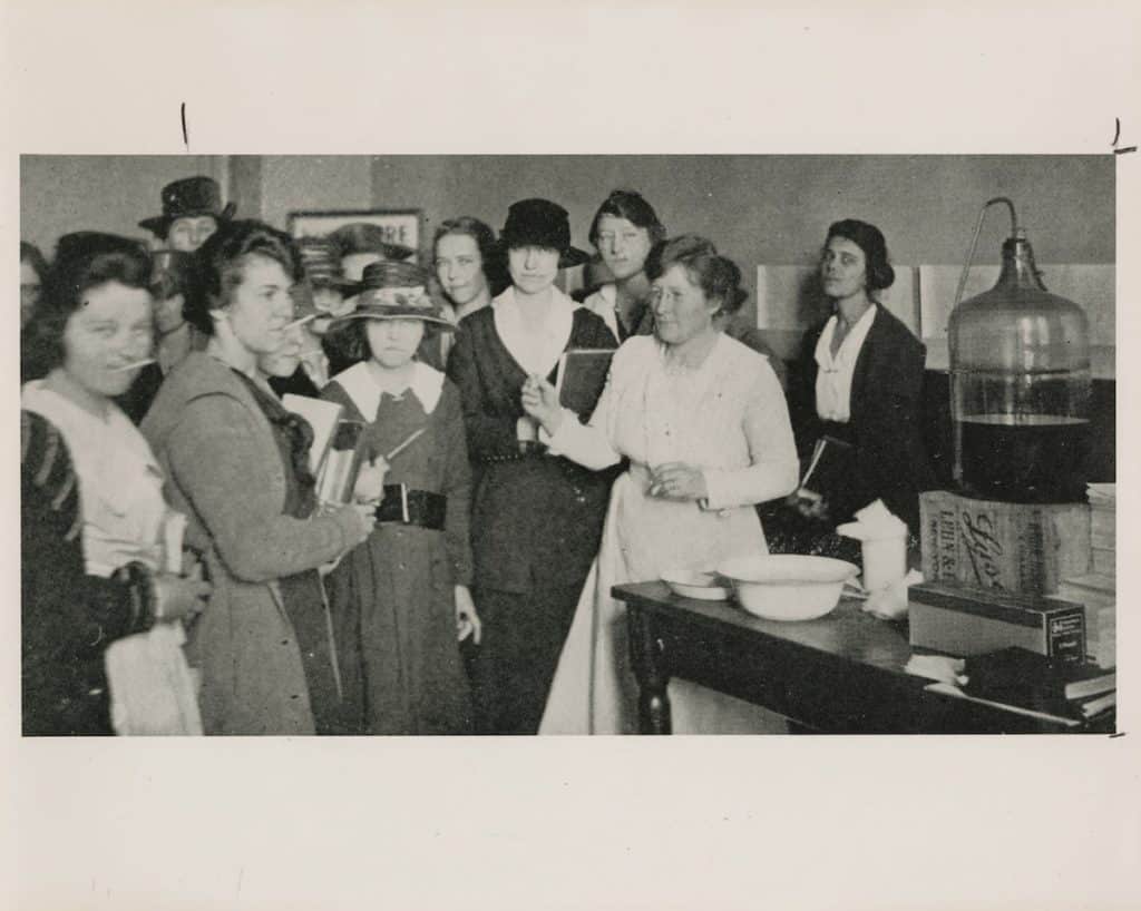 University of Texas staff and students taking precautions by taking their temperatures during the 1918 influenza pandemic. Photo no. PICA05405, Austin History Center, Austin Public Library