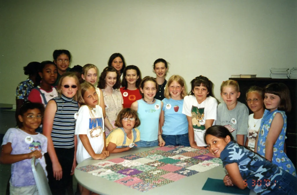 4-H club members work on a quilting project, 2001. -Courtesy of the Texas A&M AgriLife Extension Office