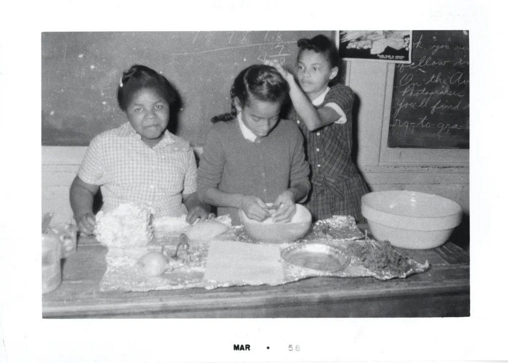 Girls in the kitchen baking, undated. -Photo No. AR 2000.025(167), Austin History Center, Austin Public Library