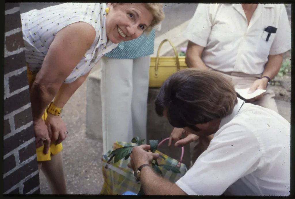 Agent Ted Fisher diagnoses a plant problem for a resident, 1982. -Photo courtesy of Ted Fisher