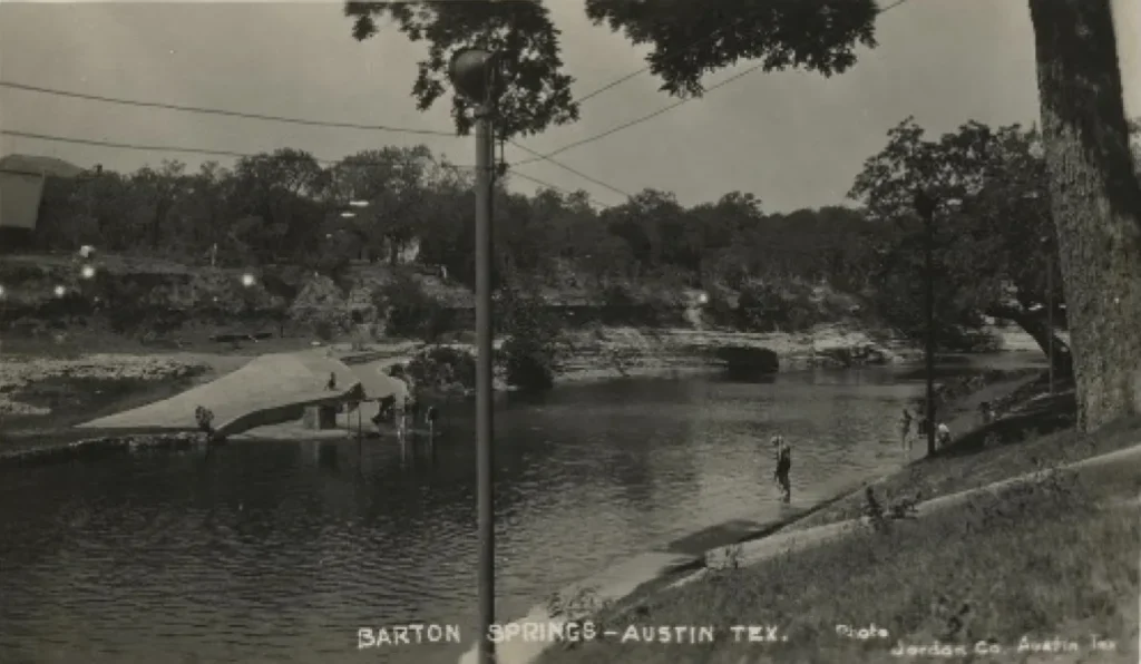 View of Barton Springs pool from the north bank, 1922. - Photo No. C01935, Austin History Center, Austin Public Library