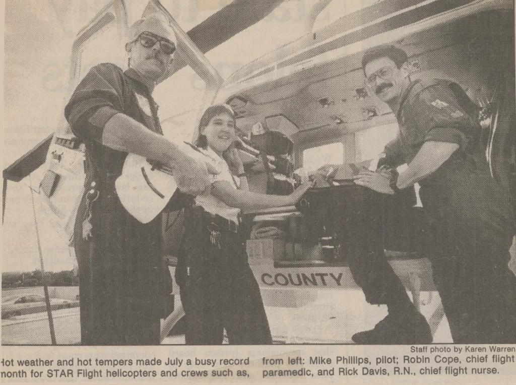 Mike Phillips, pilot; Robin Cope, chief flight paramedic, and Rick Davis, R.N., chief flight nurse. circa 1990